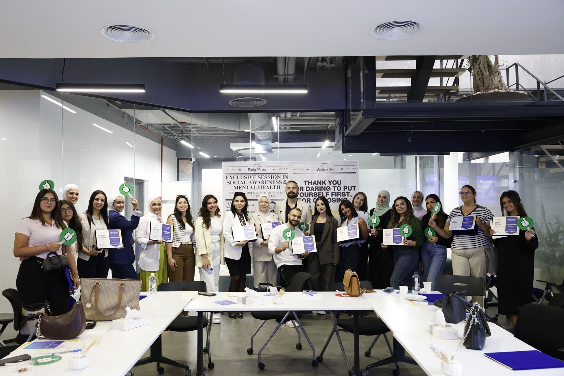 Group photo of attendees holding their certificates